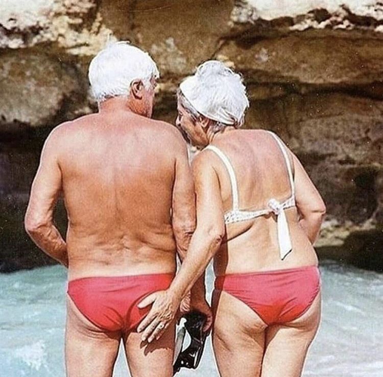 Older couple reviewing context and progress together